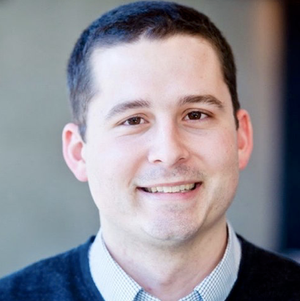 Smiling person in a professional headshot photo.